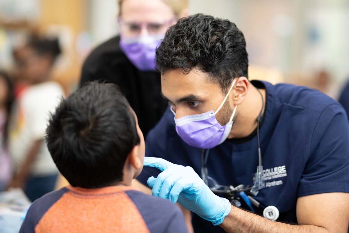 Lyon College Dental Students looking at teeth